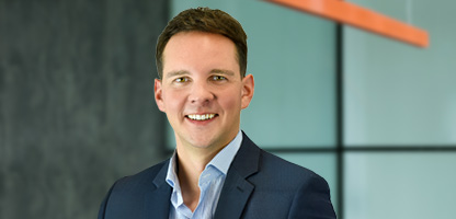 Bild – Alexander Slotty lächelt in die Kamera